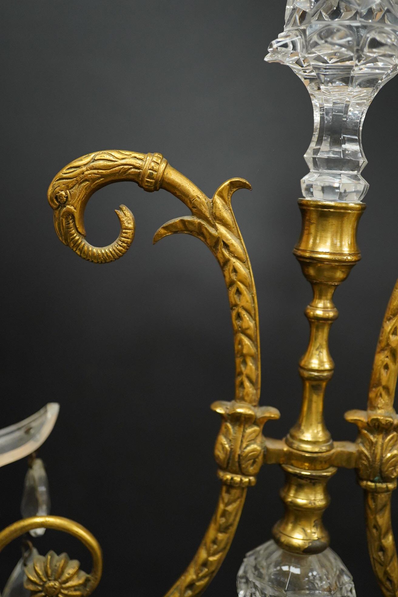 A pair of 19th century glass and gilt metal two branch candelabra with drops, 40cm high